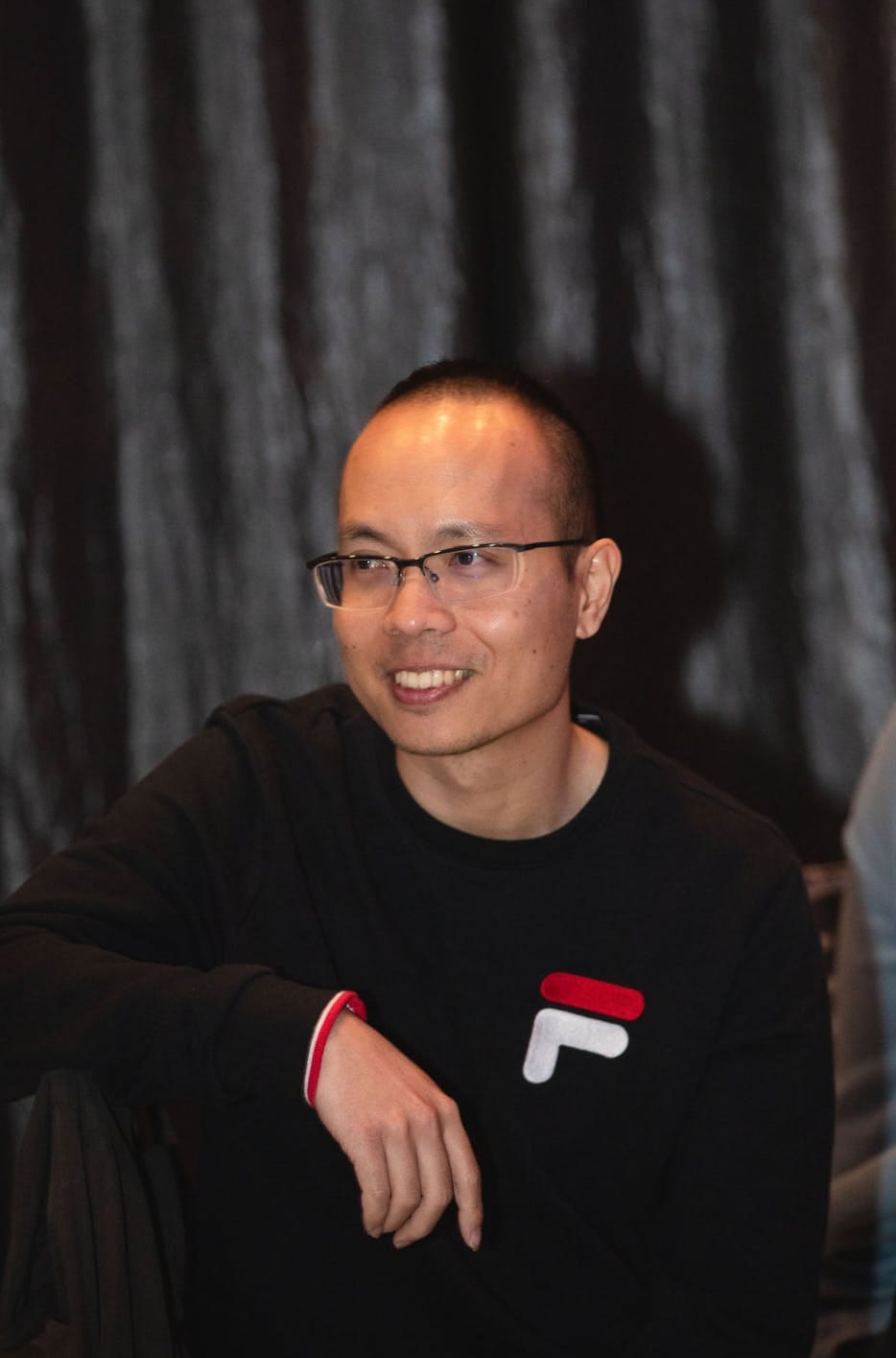 the man is looking away and smiling